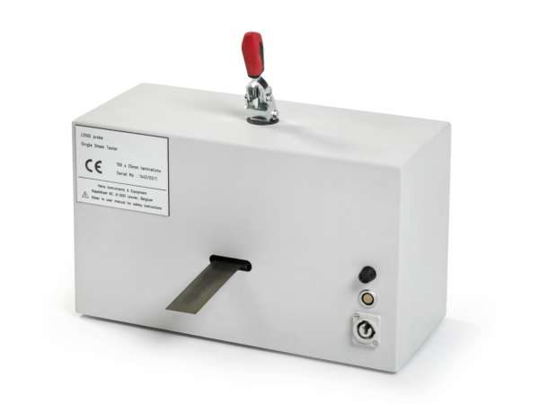 HyMAC soft magnetic materials tester shown in a clean lab setting, featuring a compact instrument with connected fixtures used to measure magnetic properties across a wide frequency range.